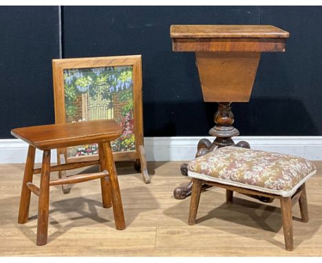 A Victorian walnut and parquetry work table, cabriole legs, 68cm high; an oak fire screen, inset with woolwork panel; an oak 