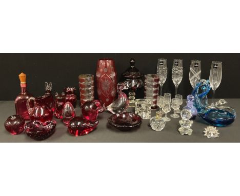 A Bohemian ruby flashed vase and cover, 23cm; a similar vase, 25cm; assorted decorative glassware, Wedgwood glass animal pape