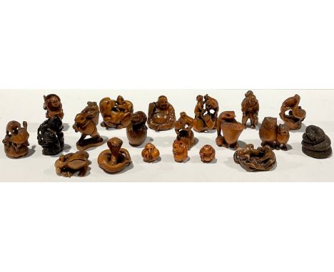 Oriental - a collection of Japanese carved hardwood netsuke, including owls, frogs, figures, snakes, etc, 20th century (20)