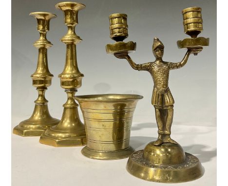 An 18th century bronze mortar, 8cm high; a pair of Victorian brass ejector candlesticks; a bronze two branch candlestick, cas