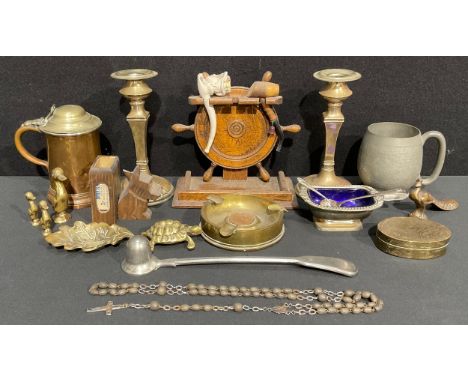 A brass shell case ashtray, with George VI copper penny; an oak ship's wheel pipe rack, 16cm, with clay pipe; a Black Forest 