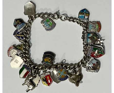 A silver charm bracelet, with 23 mostly silver and enamel charms, 44.4g gross
