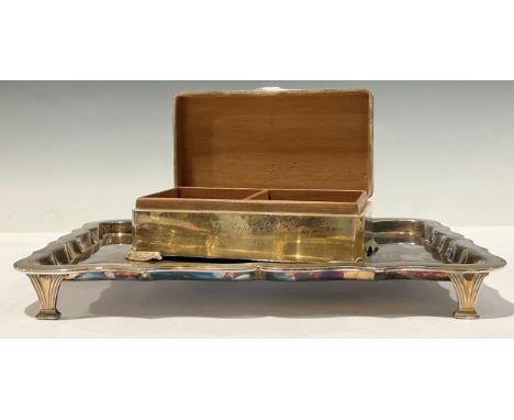 A silver canted rectangular cigarette box, engine turned cover, Celtic border and feet, 17.5cm wide, Birmingham 1955; a Hukin