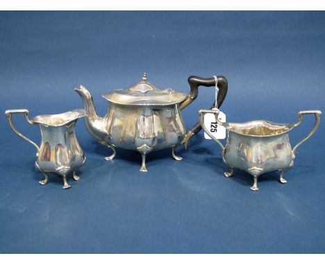 A Matched Hallmarked Silver Three Piece Tea Set, Deakin &amp; Francis, Birmingham 1906, 1907, each of shaped design, raised o