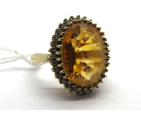 A Large 9ct Gold Citrine and Diamond Set Cluster Ring, oval multi claw set to the centre, within claw set border of uniform b