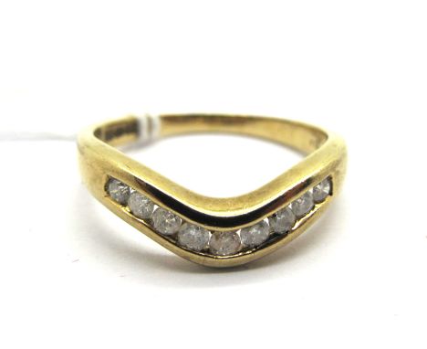 A Modern 9ct Gold Diamond Set Wishbone Ring, channel set with uniform brilliant cut stones, stamped ".25".