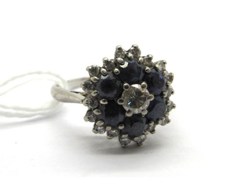 A Diamond Set Cluster Dress Ring, of shaped circular form graduated claw set throughout.