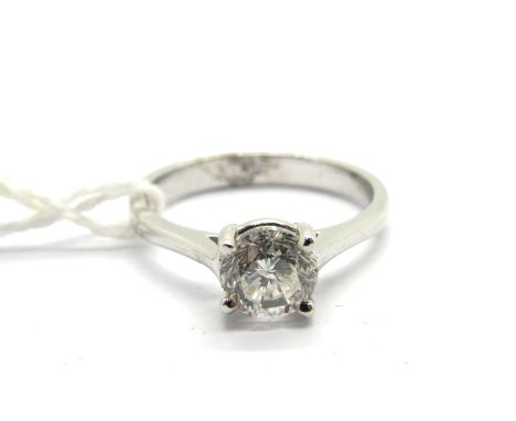 An 18ct White Gold Single Stone Diamond Ring,  the (5.5mm) brilliant cut stone four claw set between plain shoulders, approxi