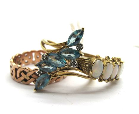 A 9ct Rose Gold Celtic Style Band, of pierced design; A 9ct Gold Five Stone Opal Ring, claw set; a modern 9ct gold ring, of a