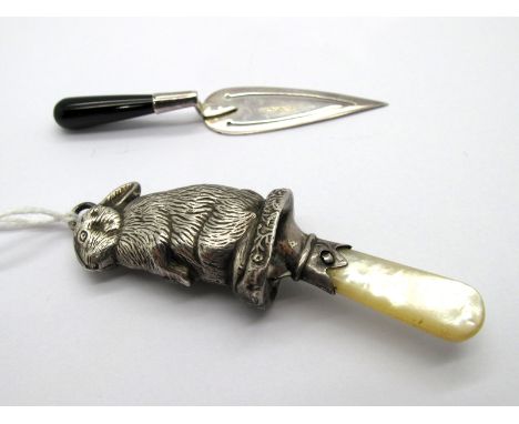 A Hallmarked Silver Baby's Rattle, (marks indistinct) as a seated bunny rabbit, with mother of pearl handle/teether, overall 