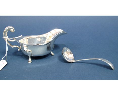 A Hallmarked Silver Sauce Boat and Matching Sauce Ladle, E. Viner, Sheffield 1932, the sauce boat with wavy cut rim and flyin