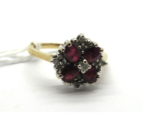 A Modern 9ct Gold Ruby and Diamond Cluster Dress Ring, claw set throughout. *Jewellery Catalogue Co. UK valuation July 23rd 2