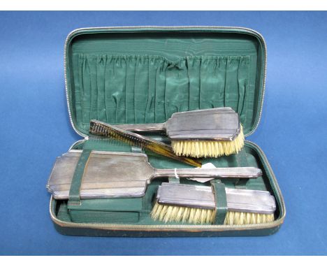 A Matched Hallmarked Silver Mounted Four Piece Travelling Set, B&amp;Co, Birmingham 1936, 1937, each with engine turned decor