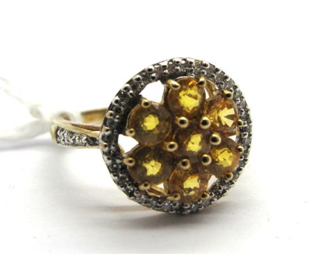 A 9ct Gold Yellow Sapphire and Diamond Set Cluster Dress Ring, of circular design, claw set throughout. *ES Jewellery Insuran