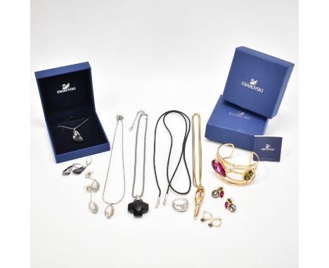 A collection of vintage Swarovski jewellery. The lot to include a yellow metal bangle set with coloured stones and matching e