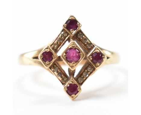 A hallmarked 9ct gold ruby and diamond panel ring. The ring having a diamond shaped head set with five round cut rubies and d