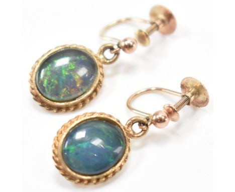 A vintage 9ct gold &amp; opal drop earrings. The earrings having bezel set opal cabochons with twisted decoration to the moun