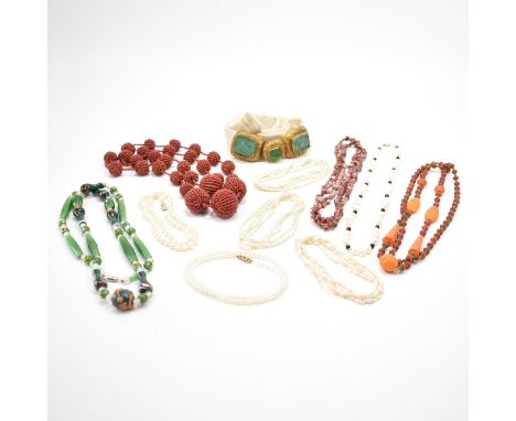A collection of vintage bead necklaces &amp; belt. The lot to include; three baroque pearl necklaces, a fabric belt with yell