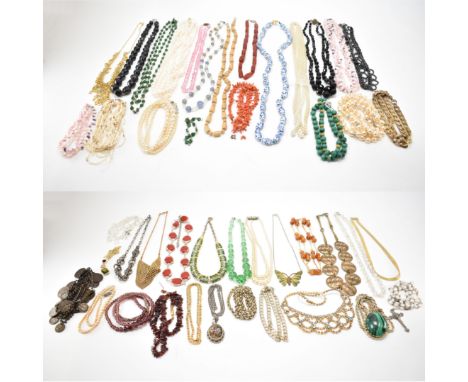 A collection of vintage beaded necklaces. The lot to include baroque pearls, glass, malachite, ceramic beads, carnelian, hema