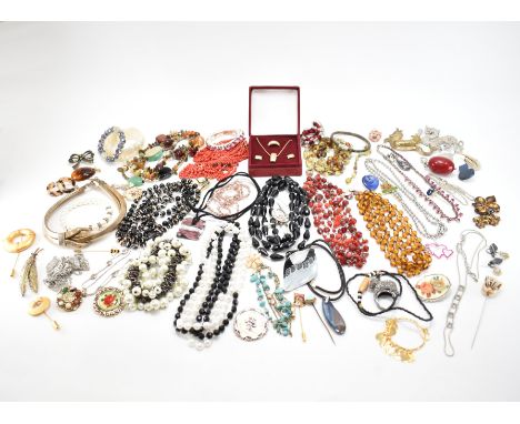 A collection of vintage costume jewellery. The lot to include; earrings, brooches, necklaces, rings, bracelets, pins, enamel,