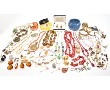 A collection of vintage costume jewellery to include glass beaded necklaces, red coral necklace and bracelet, plastic bangle 