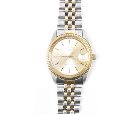 A Rotary quartz gents wrist watch having a gilt metal face with roman numeral to chapter ring with stainless steel and gilt m