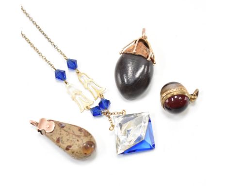 A group of antique and vintage jewellery. The lot to include a 1930s art Deco glass pendant necklace, a gold mounted nut pend