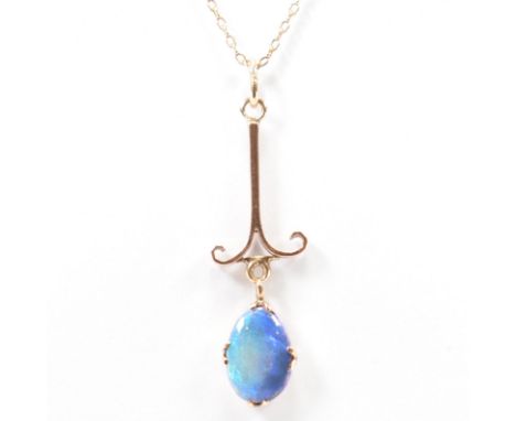 A vintage 9ct gold, opal pendant &amp; chain necklace. The pendant having a scrolled end bar suspending a claw set opal caboc