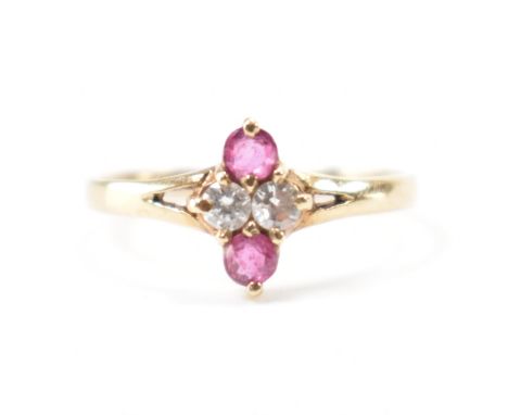 A hallmarked 9ct gold, diamond &amp; ruby ring. The ring having two round brilliant cut diamond &amp; prong set round cut rub