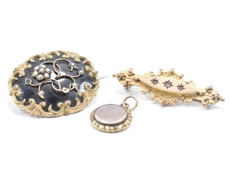 A group of 19th Century Victorian jewellery. The lot to include a gold plated mourning brooch having black enamel detailing s