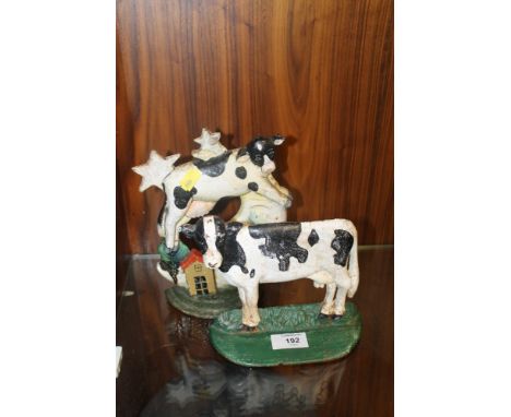 TWO CAST COW DOOR STOPS