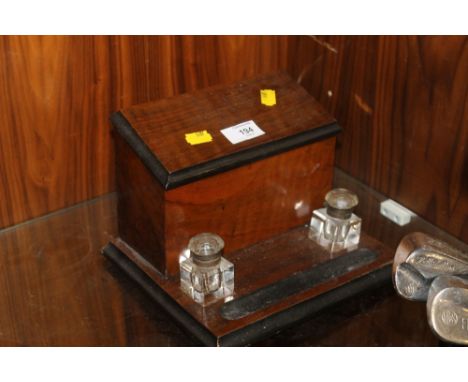 A VINTAGE STATIONARY BOX WITH GLASS INKWELLS