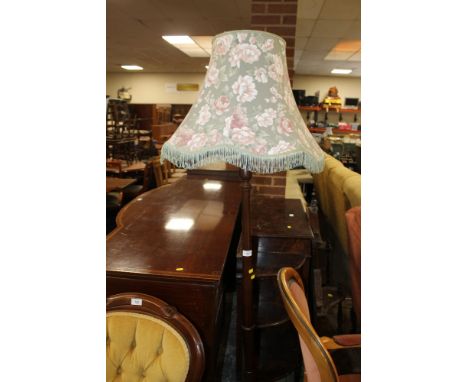 A MAHOGANY STANDARD LAMP