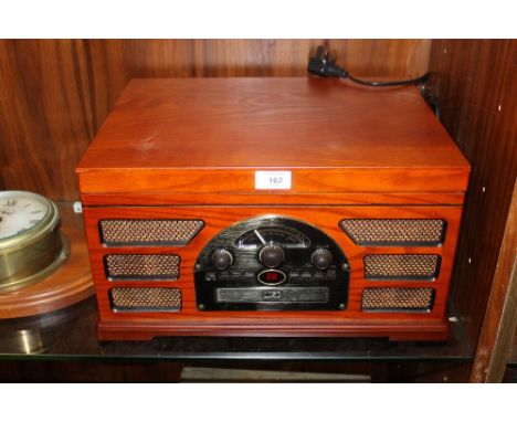 A RETRO STYLE RECORD PLAYER WITH TAPE & CD INPUTS