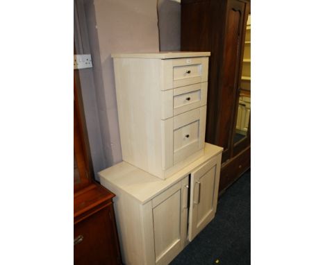 A MODERN LIGHT WOOD EFFECT CUPBOARD AND CHEST OF THREE DRAWERS