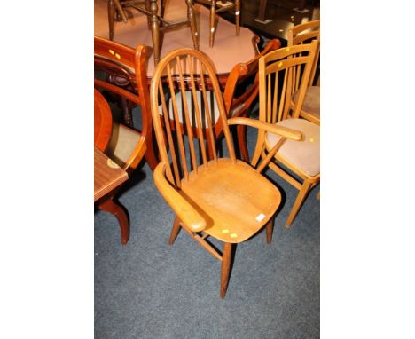AN ERCOL STYLE HOOP BACK ARMCHAIR