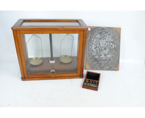 A mahogany and glazed cased set of scientific scales. 