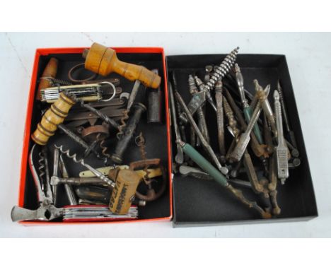 A collection of various vintage nutcrackers, a group of corkscrews including a bone handled example and a 'Guild of Sommelier