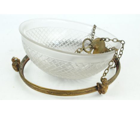 A late 19th century pendant light fitting, the frame decorated with three goats heads, with cut glass and opaque plafonnier, 