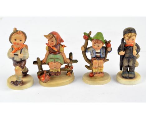 Four Hummel figures; boy with satchel, chimney sweep, boy in a tree, girl on a fence (af) (4).