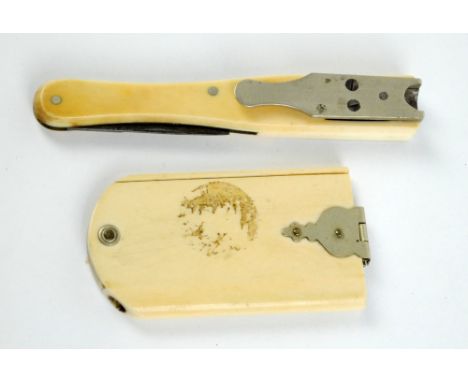 An ivory 'fan' aide-memoire with pencil aperture, 6.5 x 3.5cm, and an ivory handled quill pen nib cutter/pen knife (2).