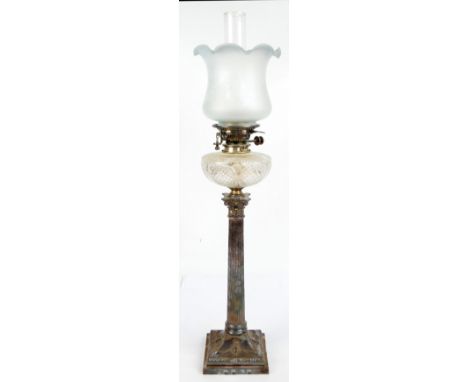 A late 19th century plated Corinthian oil lamp, the squared base decorated with swags and urns with cut glass reservoir, etch