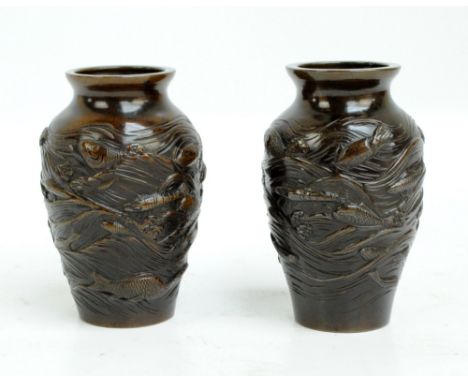 A pair of Japanese Meiji period ovoid vases, each relief decorated with shrimp, fish and octopus, both signed to base, height