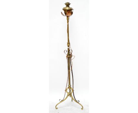An Arts and Crafts copper and brass telescopic standard lamp with pierced scrolling frame.
