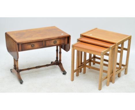 A reproduction sofa table and a nest of three occasional tables.