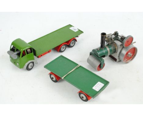 A Foden Precision Built Construction scale model lorry in green (repainted) with booklet and a steam engine (2).   CONDITION 