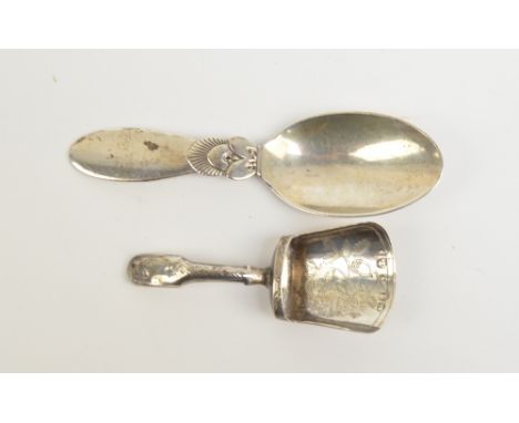 GEORG JENSEN; a George V hallmarked silver 'Cactus' pattern caddy spoon, import mark for London 1935, length 10.5cm, and a Ge