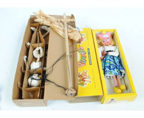 Two boxed Pelham puppets comprising a skeleton with operating instructions and a girl puppet, possibly Mitzi (2).