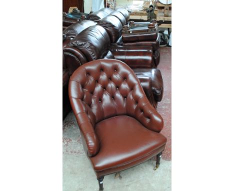 A modern leather three seater settee, armchair, pouffe and tub chair (4).