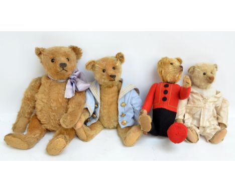 Four blonde/golden mohair jointed teddy bears, the largest with lilac ribbon, central seam, black button eyes, stitched nose 